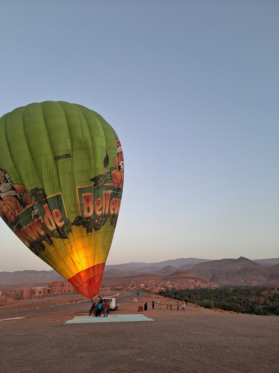 Balloon being prepared in the Ouarzazate desert landscape